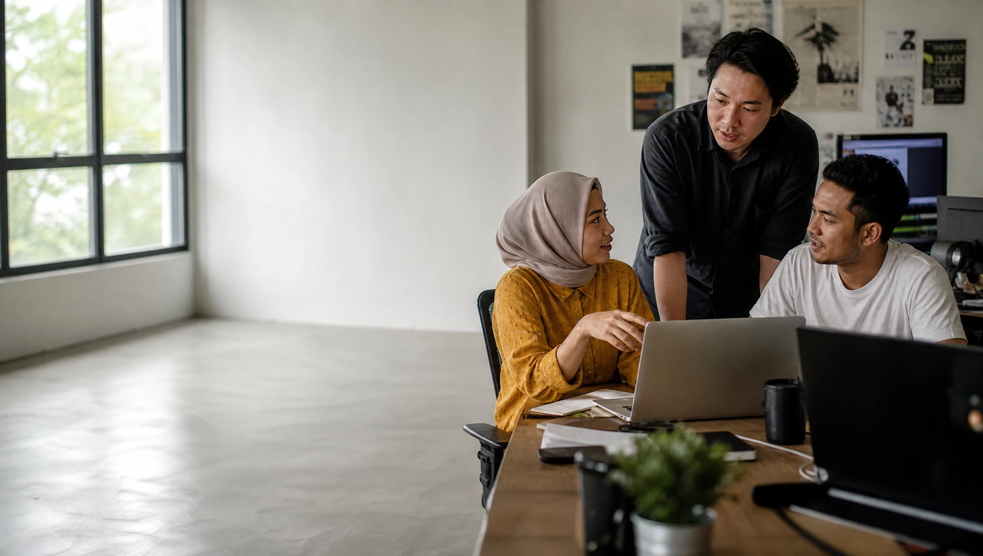 The Baloot.my team working together in their Malaysian studio