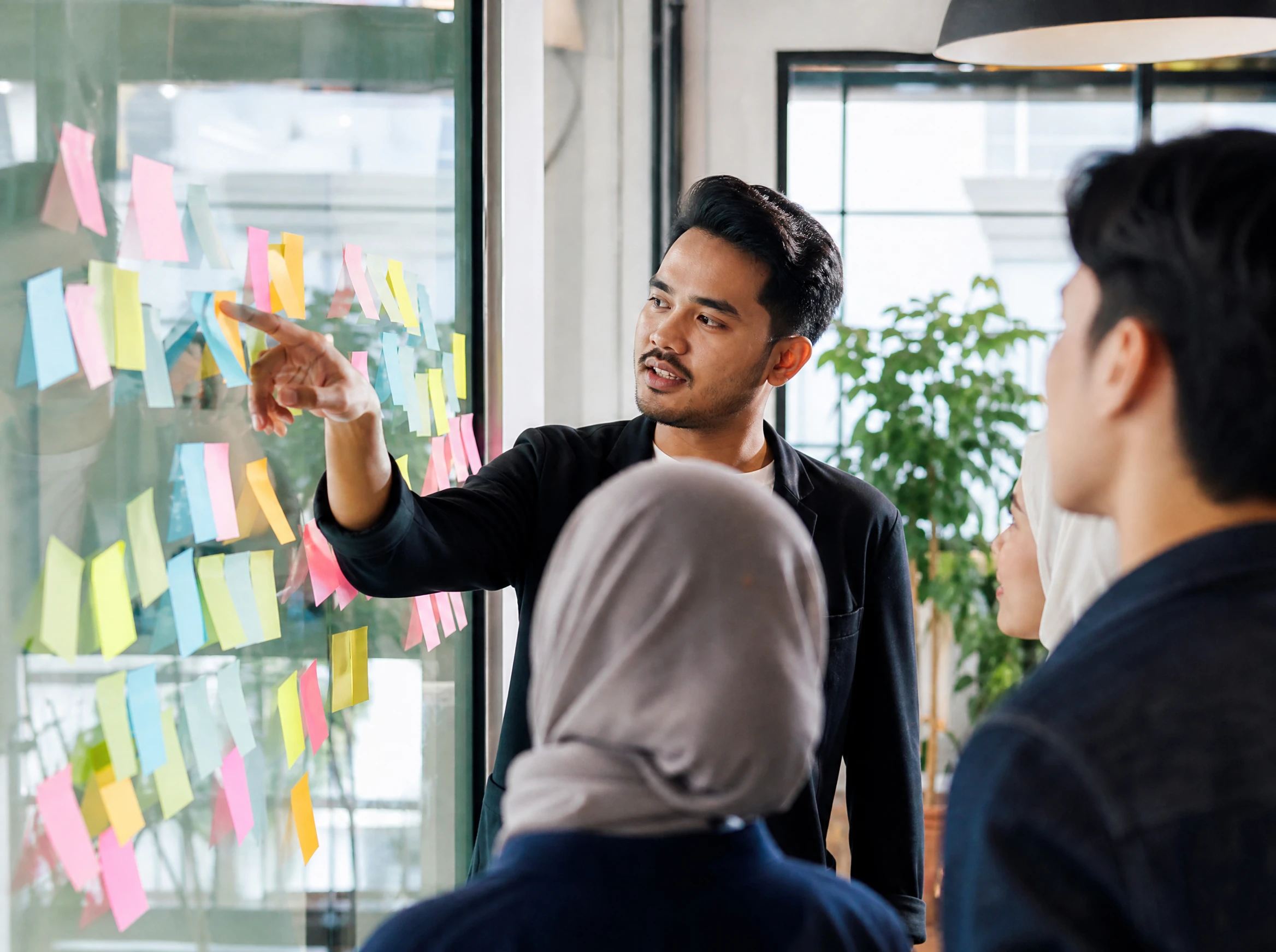 Malaysian marketer planning keywords with sticky notes