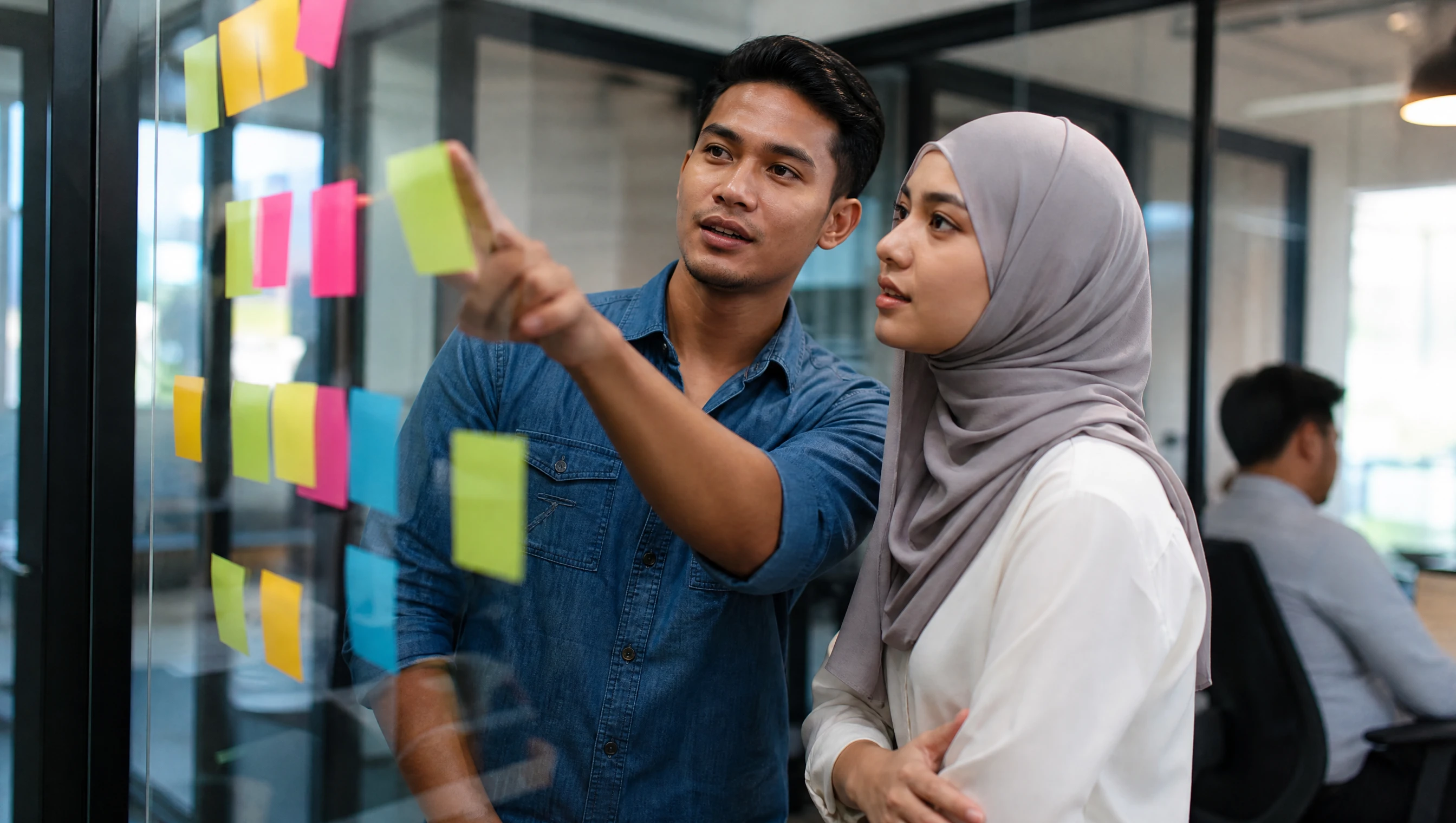 Malaysian developer and client mapping requirements on a whiteboard
