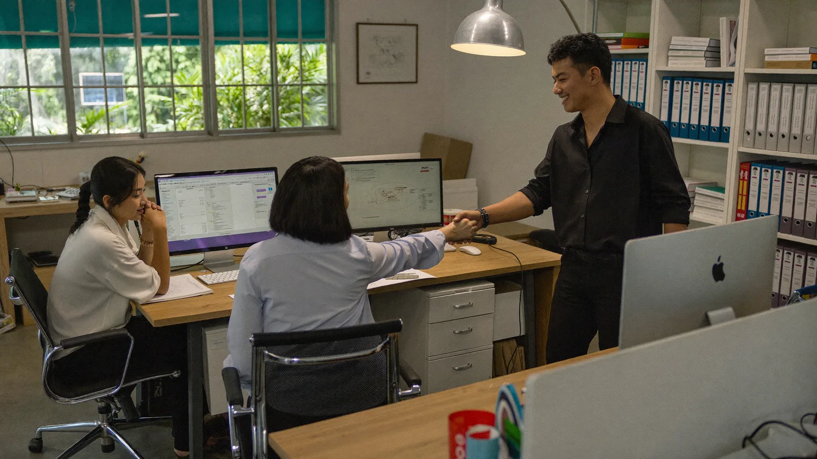 Team installing and training staff on new Windows software in an office