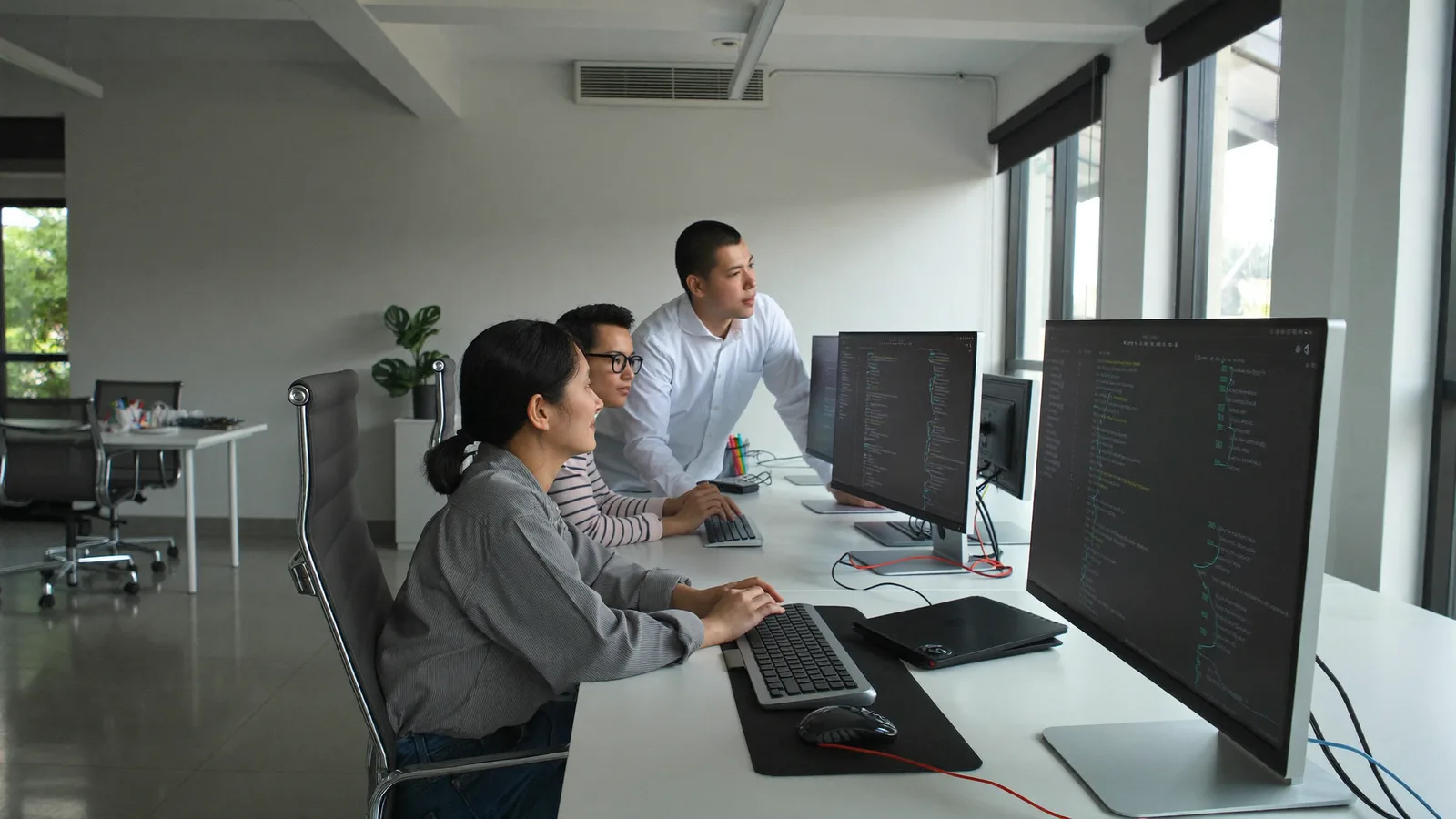 The Baloot.my software development team working in their studio